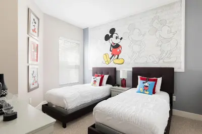a bedroom with two beds and a mickey mouse mural at Summerville Resort 4 Bedrooms Villa in Orlando
