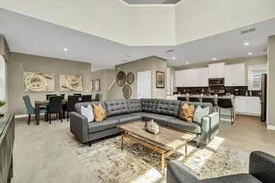 a living room with a couch and a table at Boutique Style Home Near Disney! home in Kissimmee