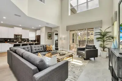 a living room with a couch and a table at Boutique Style Home Near Disney! home in Kissimmee