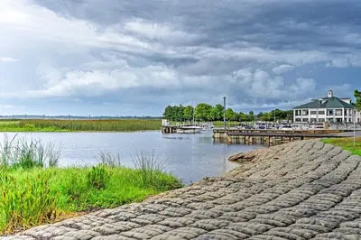 a view of a body of water with a dock at Family Home with Private Pool 24 Mi to Disney! in Saint Cloud