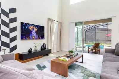 a living room with a couch and a coffee table at Gorgeous 5BDR Family with Pool at Storey Lake 2767 O in Kissimmee