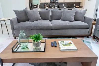 a living room with a couch and a coffee table at Gorgeous 5BDR Family with Pool at Storey Lake 2767 O in Kissimmee