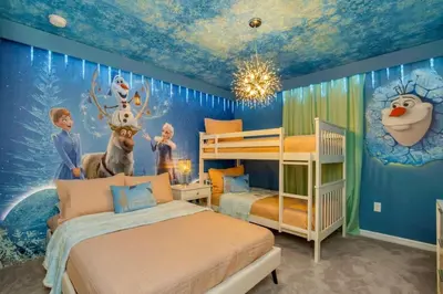 a bedroom with two beds and a wall with a mural at Amazing Game Room Your Kids Will Love! villa in Kissimmee