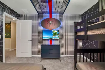 a bedroom with a room with a bed and a mirror at Amazing Game Room Your Kids Will Love! villa in Kissimmee