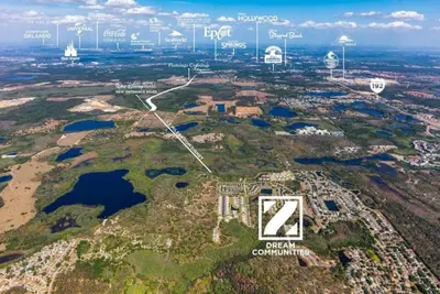 an aerial view of an island with several lakes and buildings at Great 4 bedroom townhouse in Hidden Forest, with private pool! in Orlando