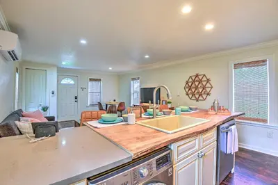 a kitchen with a sink and a counter top at 16 Mi to Disney Cottage with Deck in Winter Garden in Orlando