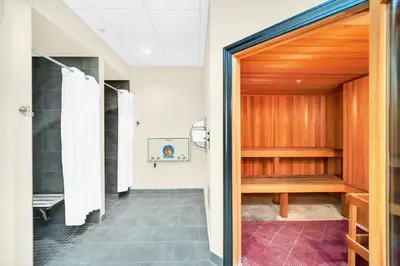 a hallway with a door leading into a bathroom at Modern 3BR - Near Disney - Pool in Orlando