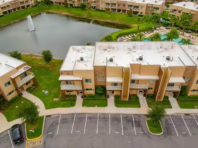 an aerial view of a building with a body of water at Beautiful Townhome Overlooking The Lake And The Pool in Orlando
