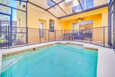 a swimming pool in a house at Appealing, Large 5BD Home Close to Themed-Parks #5PP961 in Kissimmee