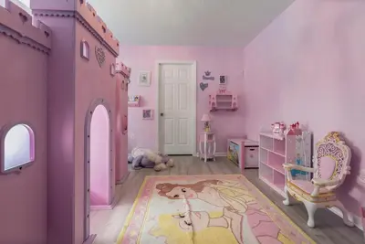 a childs bedroom with a pink room with a horse on the floor at Spacious 6BR Villa Pool Parking Near Disney World in Orlando