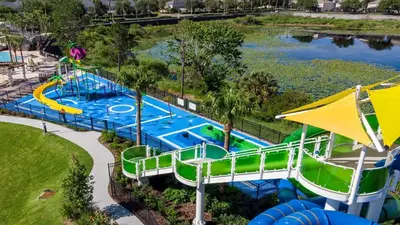 an aerial view of a water slide at a water park at Spacious 6BR Villa with Pool SPA 3 Miles to Disney in Orlando