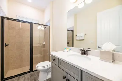 a bathroom with a toilet and a sink and a shower at Sunrise Cottage Near Disney With Margaritaville Resort & Island H20 Waterpark Access - 2966Sr in Orlando