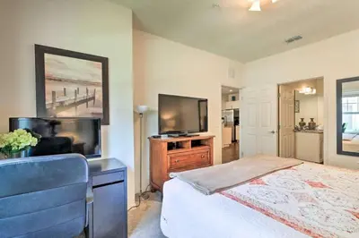 a bedroom with a bed and a flat screen tv at Marvelous 3 Bd Close To Disney @ Lucaya Resort 107 5364 in Kissimmee