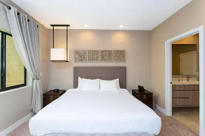 a bedroom with a large white bed and a window at Gorgeous 4Bd Close to Disney @ Magic Village 7581 in Orlando
