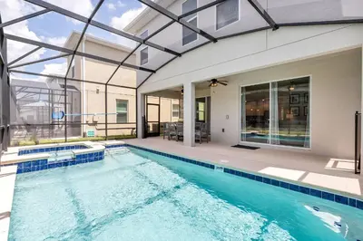 a swimming pool in a house with a building at Lovely Private Pool Villa wFREE Resort Access in Kissimmee