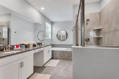 a bathroom with a tub and a sink and a shower at Lovely Private Pool Villa wFREE Resort Access in Kissimmee