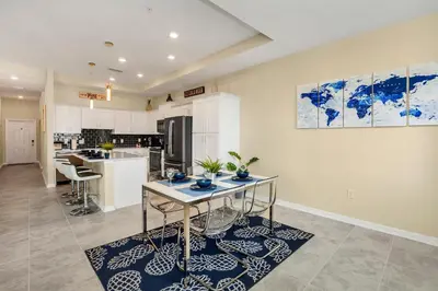 a kitchen with a table and chairs in it at Cozy Condo Near Disney wPool View FREE WaterPark in Kissimmee