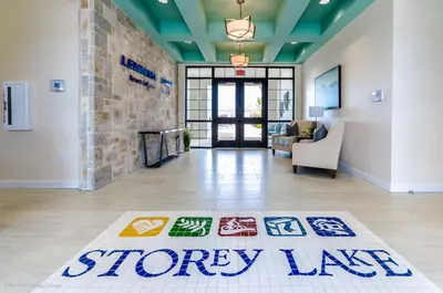 a storey lobby with a sign on the floor at Cozy Condo Near Disney wPool View FREE WaterPark in Kissimmee