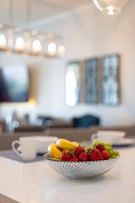 a bowl of fruit on a counter in a kitchen at Top floor condo with view of lake, pool and fireworks! Next to Convention Center! in Orlando
