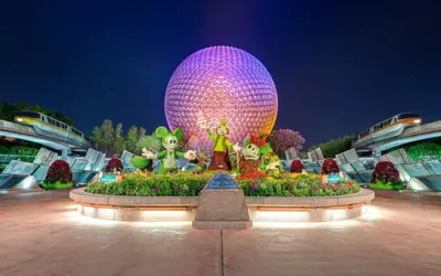 a large purple disco ball in a garden at night at Bposhtels Orlando Florida Mall in Orlando
