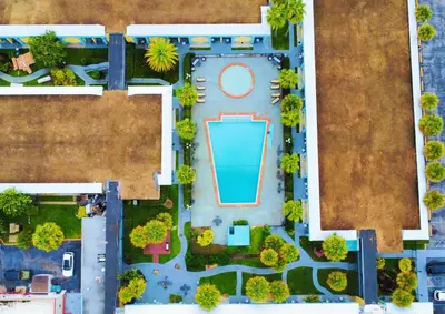 an overhead view of a pool in a park at Bposhtels Orlando Florida Mall in Orlando