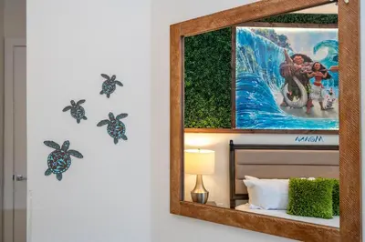 a mirror on a wall with turtles on it at Themed Disney House 5 min to Disney Parks, Heated Pool, Jacuzzi, Gym and more in Orlando