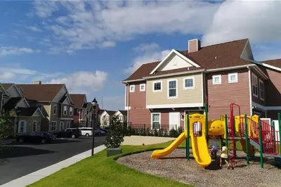 a playground with a slide in a residential neighborhood at Themed Disney House 5 min to Disney Parks, Heated Pool, Jacuzzi, Gym and more in Orlando