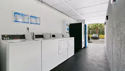 a white room with white counters and a parking lot at Home 1 Suites Extended Stay - Kissimmee in Kissimmee