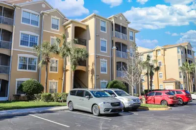a parking lot in front of a apartment building at Windsor Hills Resort 3 Bedroom Condo 5 Minutes to Disney in Orlando