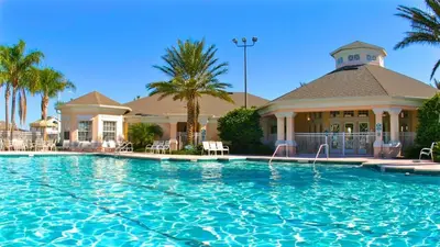 a large swimming pool in front of a house at Windsor Palms Resort 3 Bedroom Condo 6 Miles to Disney in Kissimmee