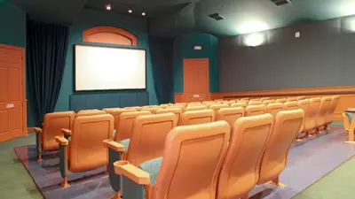 an empty lecture room with chairs and a screen at Windsor Palms Resort 3 Bedroom Condo 6 Miles to Disney in Kissimmee