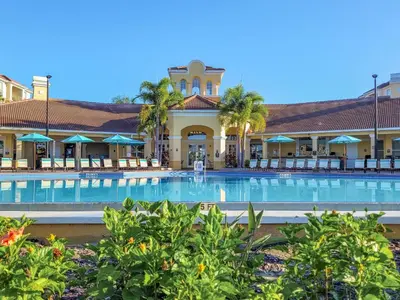 a swimming pool in front of a resort at 3Br 2Bath Condo Balcony 5min Conv Center 1388ft in Orlando
