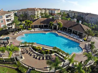 an aerial view of a swimming pool at a resort at 3Br 2Bath Condo Balcony 5min Conv Center 1410ft in Orlando