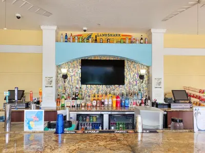 a bar with a tv on a wall in a store at 3Br 2Bath Condo Balcony 5min Conv Center 1410ft in Orlando