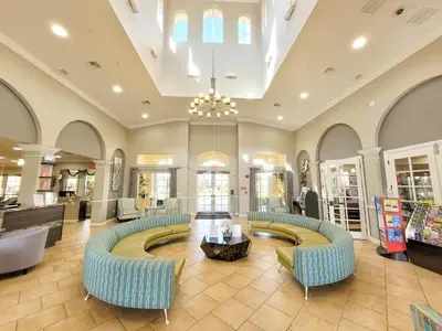 a lobby with couches and a table in a store at 3Br 4 Bath Large Condo 5min Conv Center 1732ft in Orlando