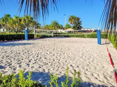 a sandy beach with blue barriers on it at 5Br 5Bath Pvt Home BBQ Pool 10min Disney 3077ft in Kissimmee