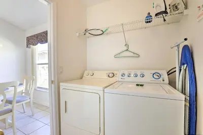 a laundry room with a washer and dryer at 8 Mi to Disney World Home with Lanai and Game Room! in Kissimmee