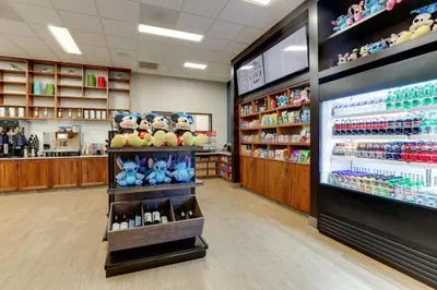 a store aisle with a shelf with stuffed animals at Drury Plaza Hotel Orlando - Disney Springs Area in Orlando