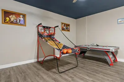 a room with a ping pong net and a table at WindsorHills Villa Pool Resort Amenities Minutes to Disney in Orlando