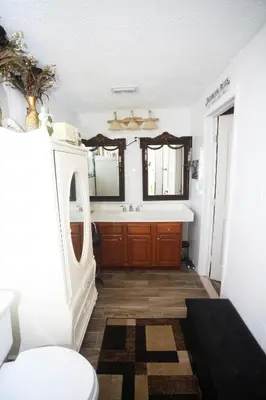 a bathroom with a sink and a toilet at Beautiful large bedroom in Orlando