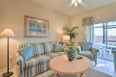 a living room with a couch and a table at 6 Mi to WDW Family-Friendly Townhome with Foosball! in Kissimmee
