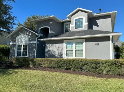 a house with a blue and white at Mickeys Palm - Brand New! 6BR Modern with Private Pool Hot Tub BBQ Home Theater - 2 Miles to Disney in Orlando