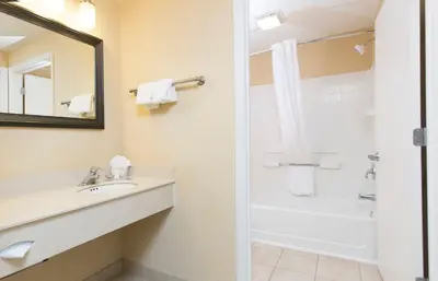 a bathroom with a sink and a shower at staySky Suites I-Drive Orlando Near Universal in Orlando