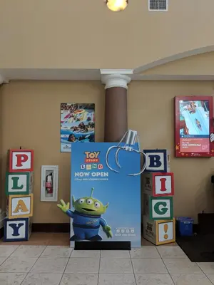 a sign for a toy store with a frog on it at Hawthorn Extended Stay by Wyndham Orlando in Orlando