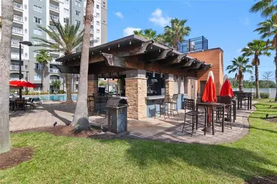 a bar with tables and chairs in a park at Premier Resort Condos Near Disney & Universal in Orlando