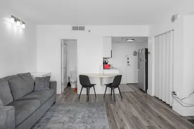 a living room with a couch and a table at Cozy Condo on International Dr. Near Universal Studios in Orlando