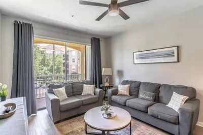 a living room with a couch and a table at 2821 Windsor Hills in Orlando