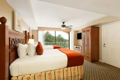 a hotel room with a bed and a window at Westgate Towers Resort in Orlando