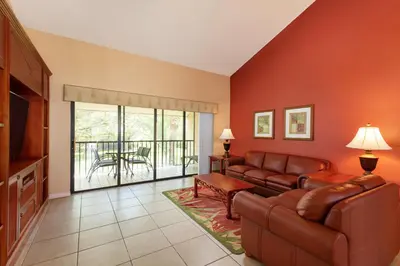 a living room with a couch and a television and a table at Westgate Vacation Villas Resort in Orlando