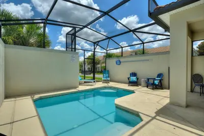an indoor swimming pool with a glass roof at Refurbished! Lazy Life At Storey Lake By Shine Villas #901 in Kissimmee